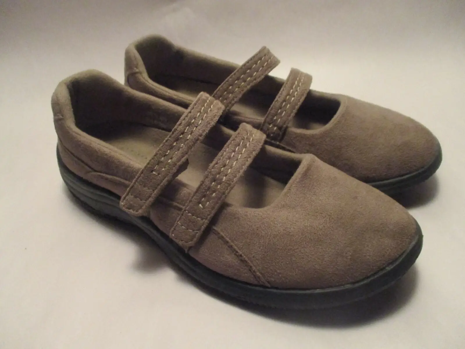Pair of brown Mary Jane shoes with double straps.