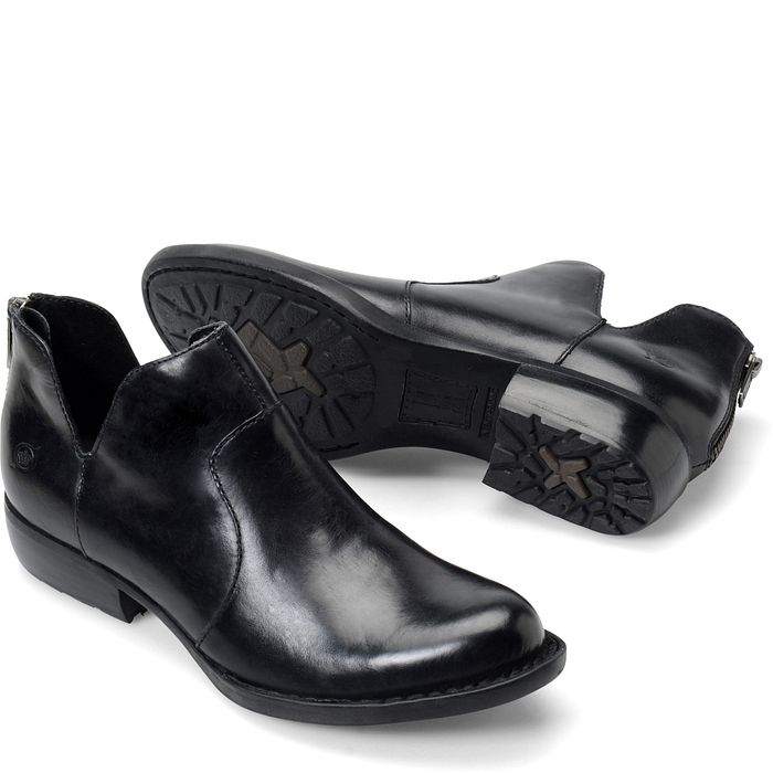 Pair of sleek black leather dress shoes with a unique design.
