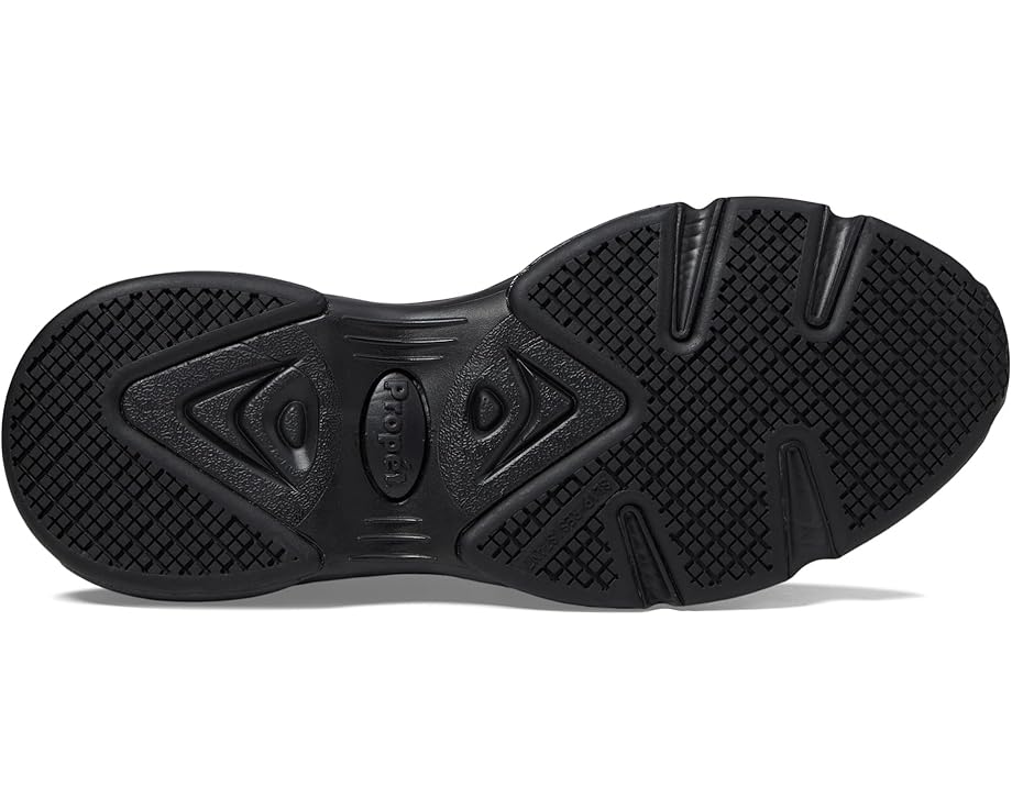 Close-up of a black rubber shoe sole with textured grip pattern.