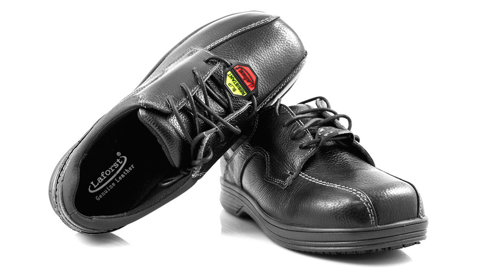 Pair of polished black leather dress shoes with laces.